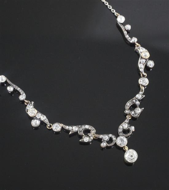 A Victorian gold, silver and old mine cut diamond set platinum chain necklace, 44cm.